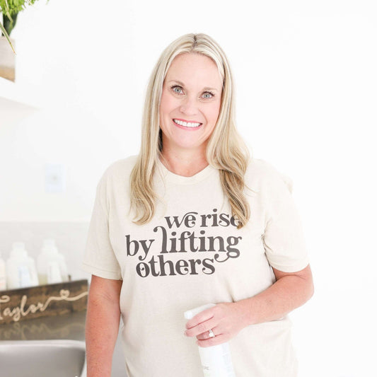 We Rise By Lifting Others - Heather Oatmeal - Sunfire Tees